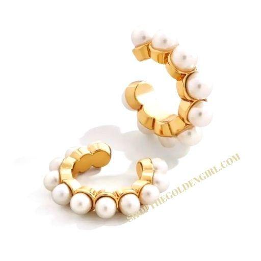 This ear cuff features round-shaped fresh water pearls on shiny gold plating.  Inside diameter: .40". Width: .11". Weight: .05 oz.