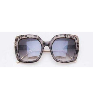 Sunglasses with Wide plastic frames with gold legs 